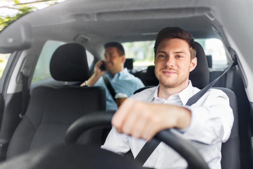 a rideshare driver with a passenger in the back