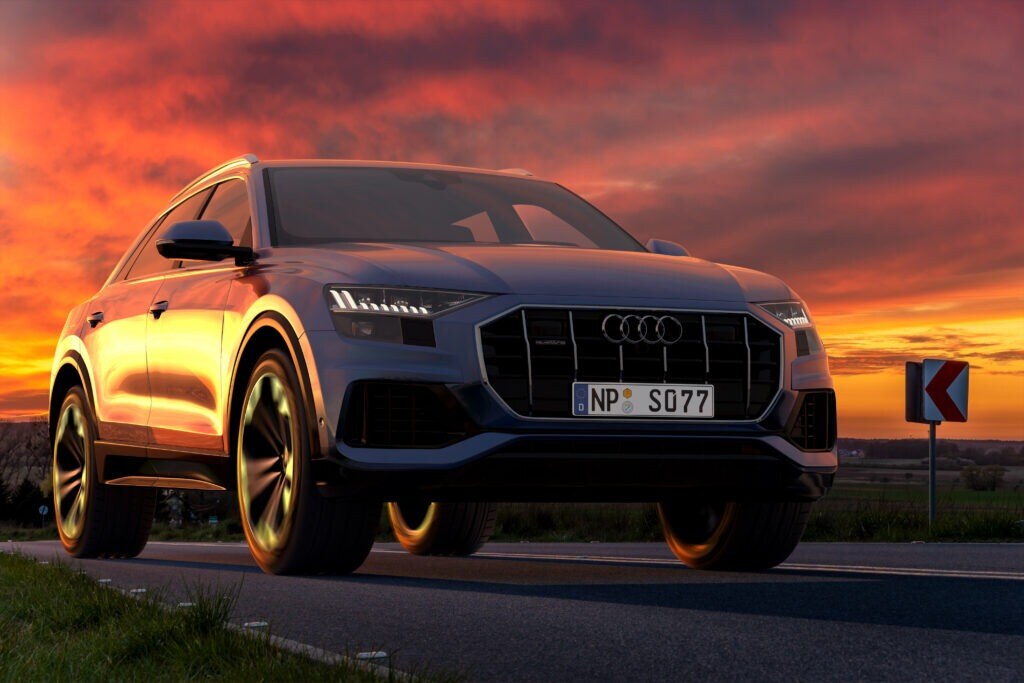 a grey Audi Q8 at sunset