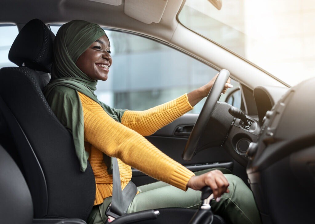 a smiling rideshare driver