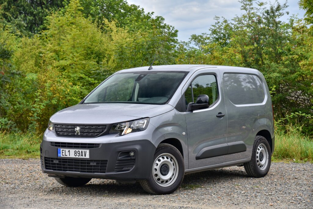 a grey peugeot partner - a model of small van