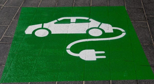 a green EV parking space