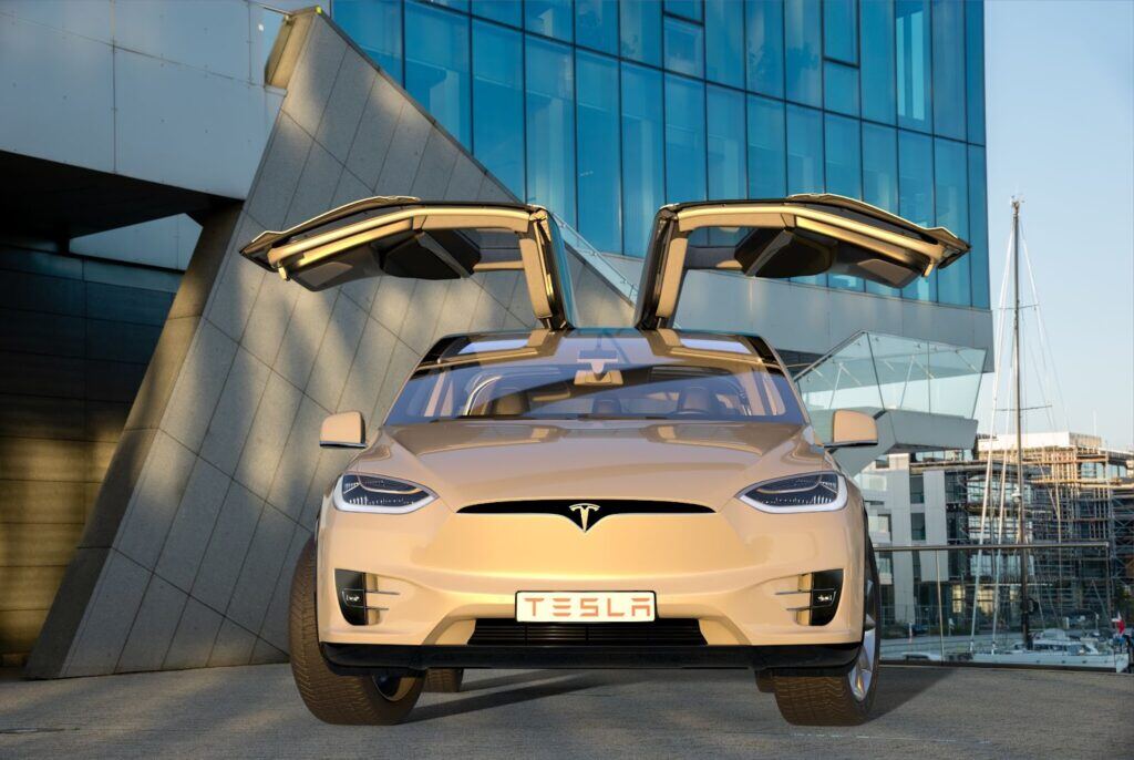 a white tesla with the doors open