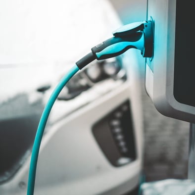 charging cable plugged into electric vehicle