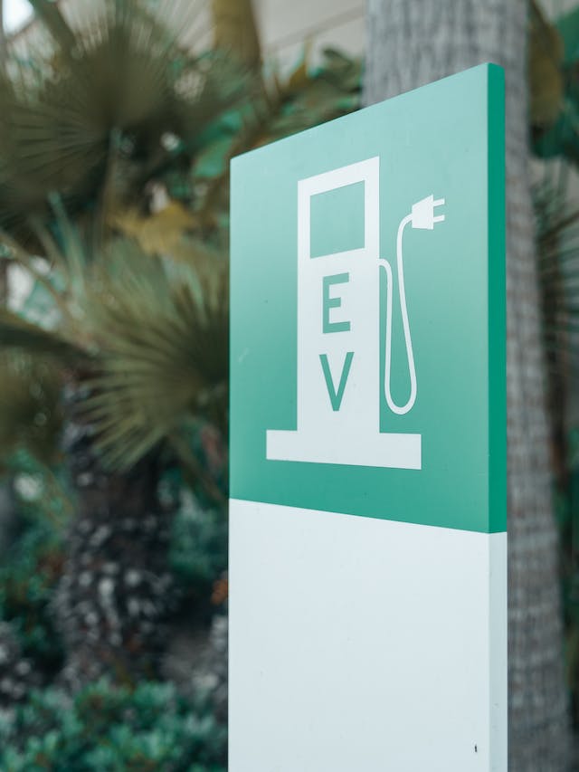 a green EV charging sign