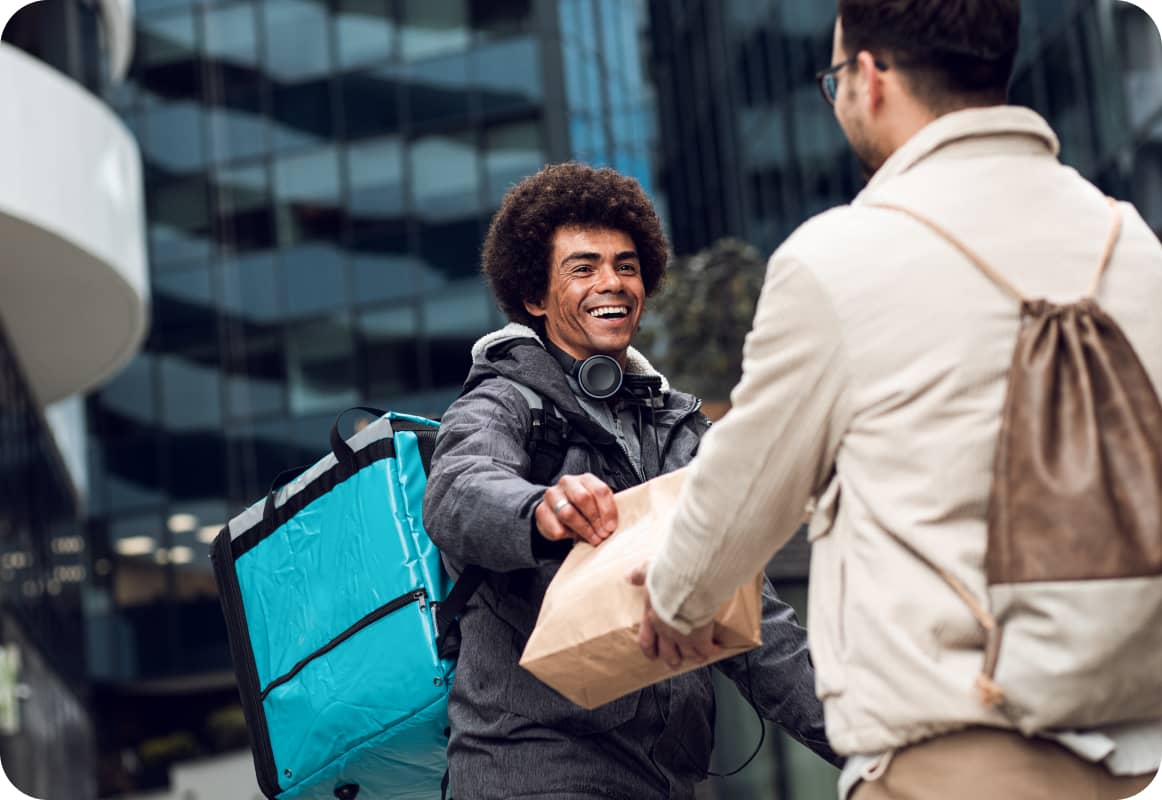 Food delivery man with cyan bag passing bag