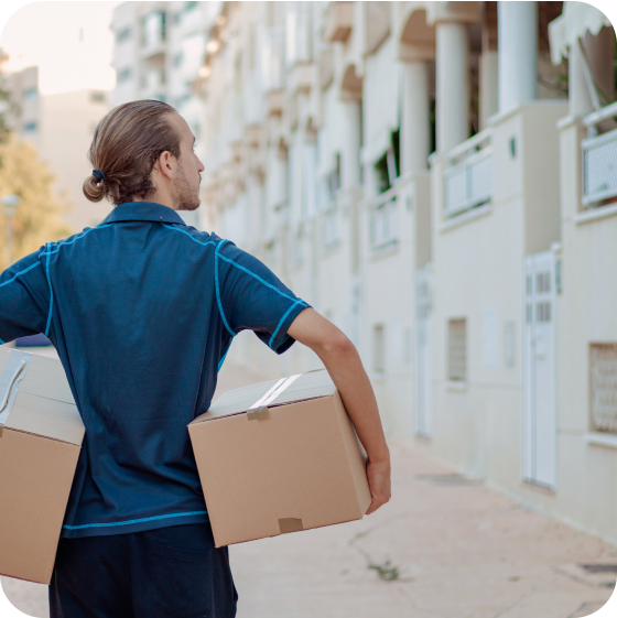 Man holding parcels under both arms