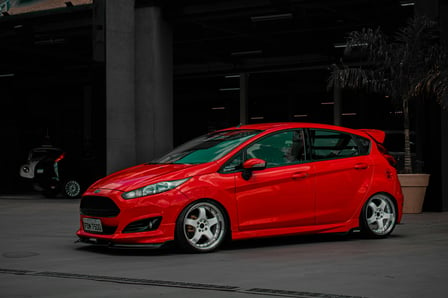 a parked red ford fiesta