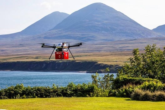 royal mail flying drone holding a parcel