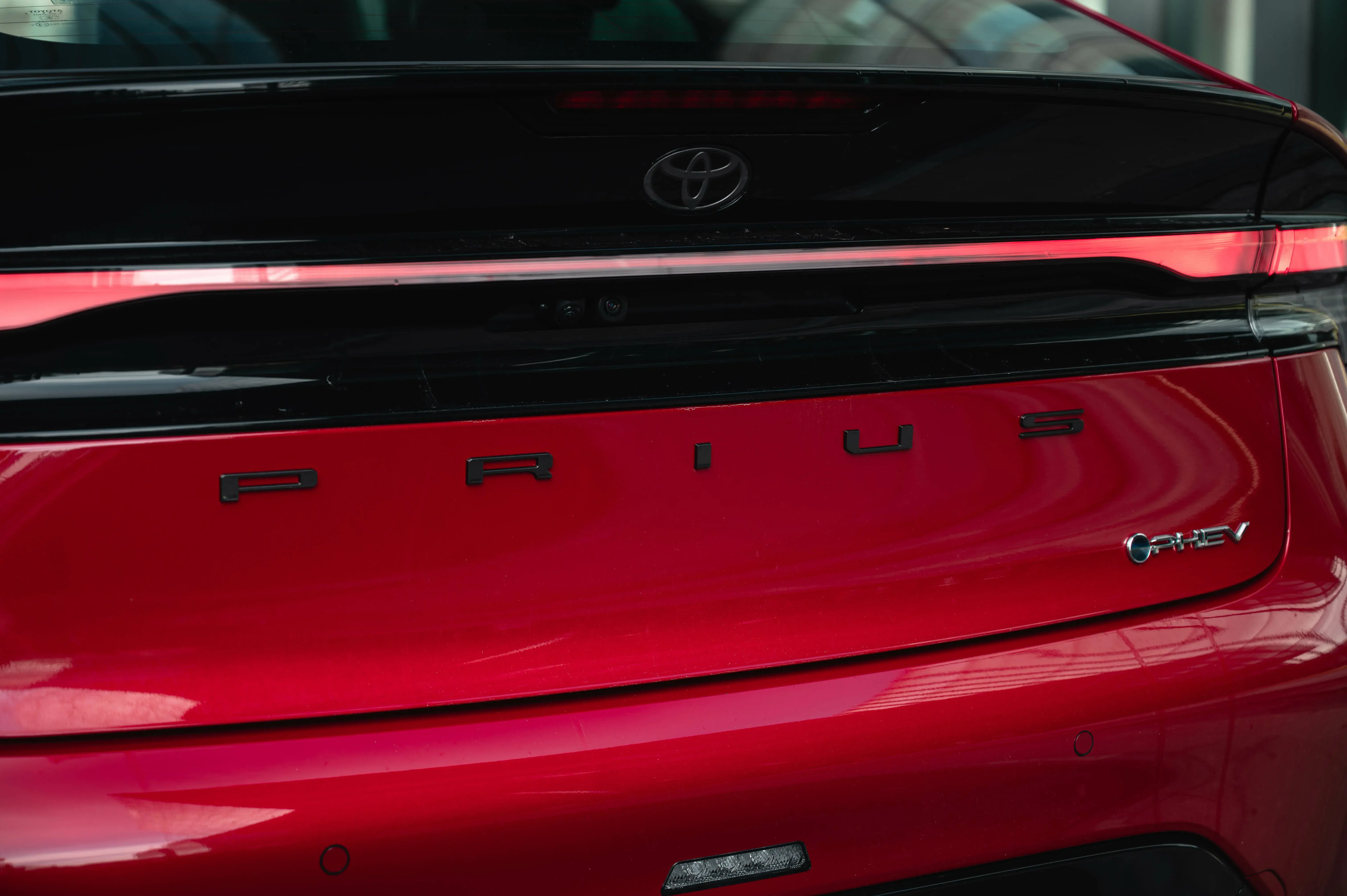 Rear view of a red Toyota Prius