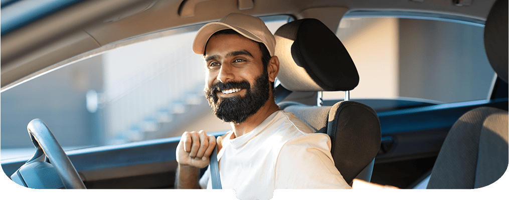 Courier-in-car-rearview-mirror-view (1)