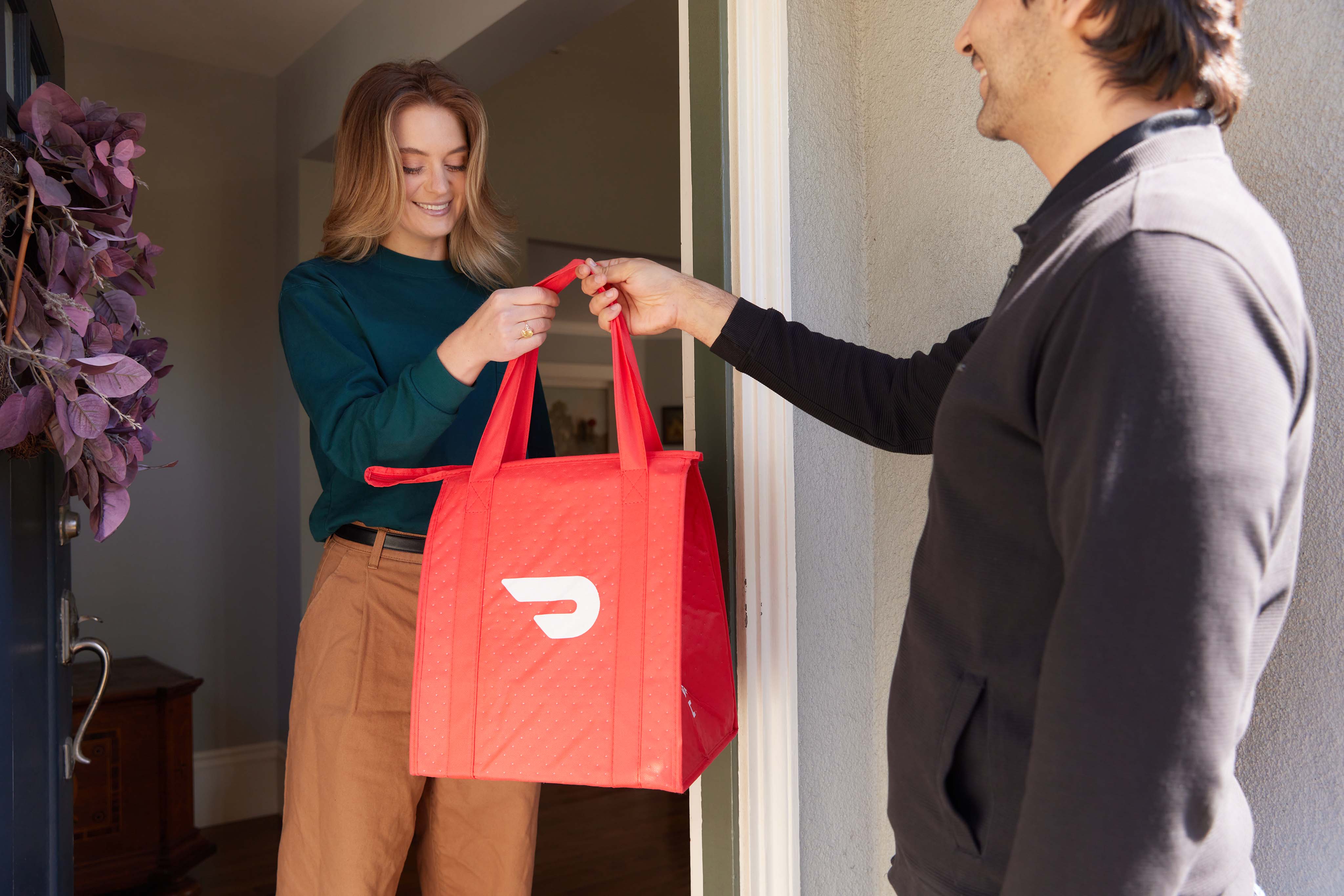 Doordash delivery man delivering to a woman