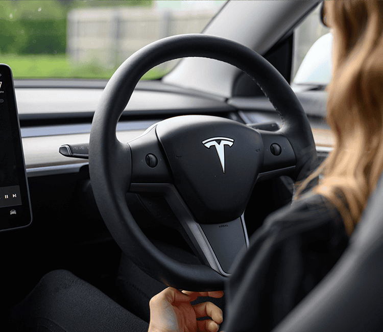 woman driving a Tesla