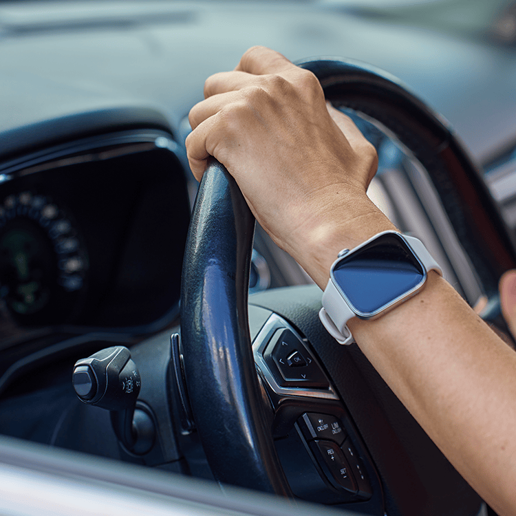 Hands-on-wheel-driving-rental-car