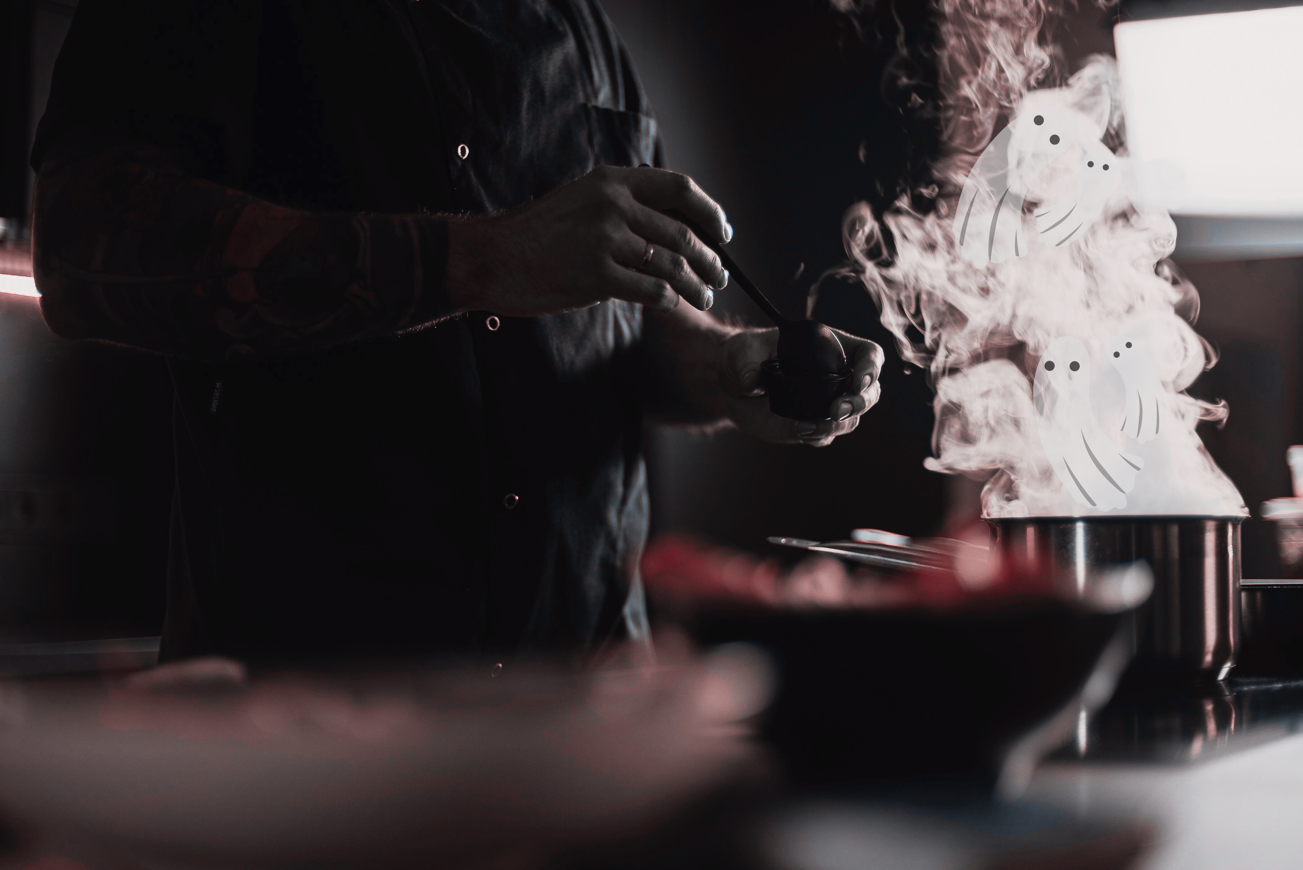 a man holds a ladle next to a steaming pot