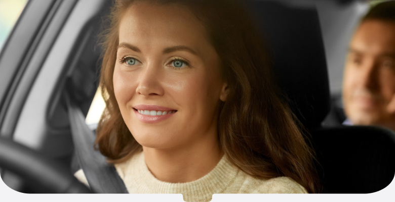 Women in jumper driving passenger-mobile