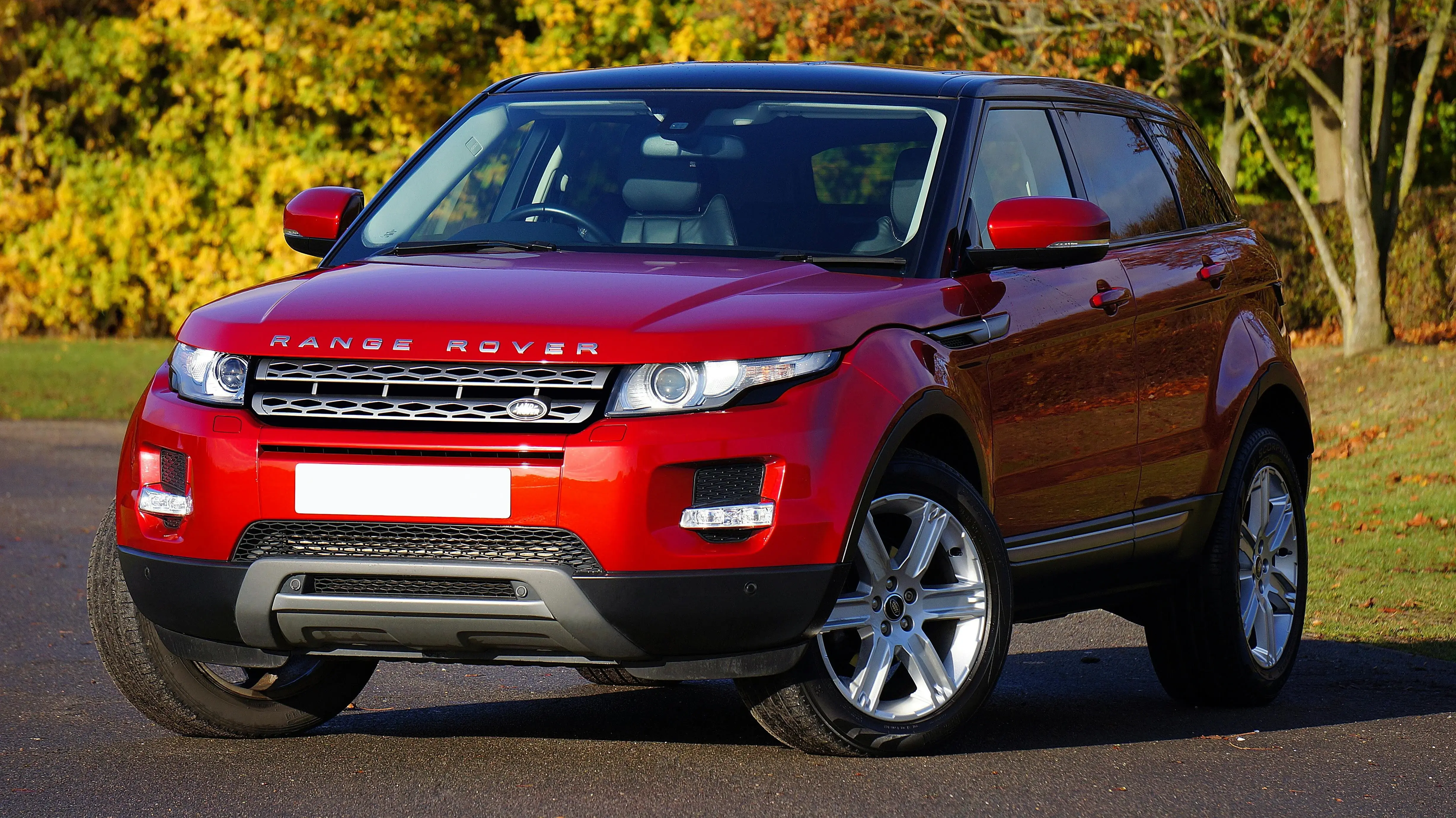 a parked red range rover